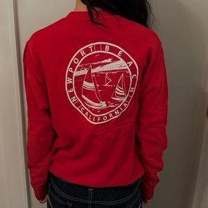 red graphic “newport beach” crewneck.